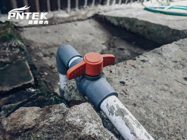 A brittle, sun-damaged PVC valve next to a new, pristine Pntek valve