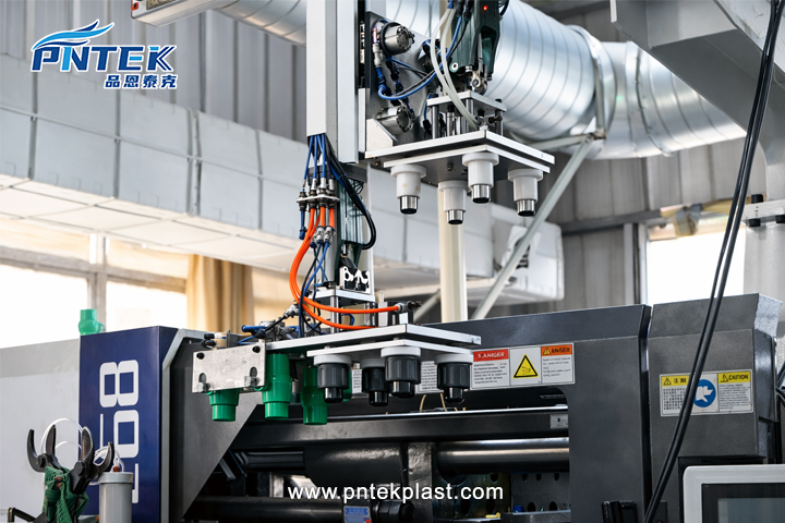 Automated Valve Manufacturing Process A clean, automated factory floor showing robotic arms assembling plastic valves