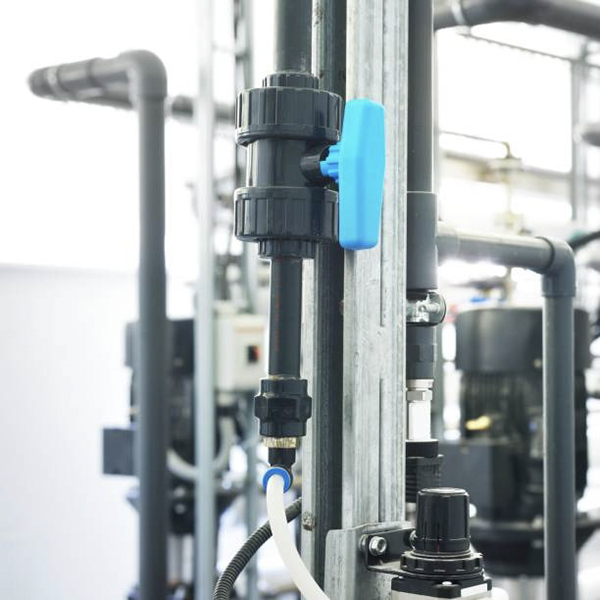 A PVC true union ball valve installed with plenty of space around the handle and unions