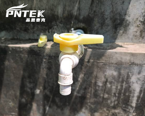 A rugged bib tap placed next to a sleek kitchen tap for comparison