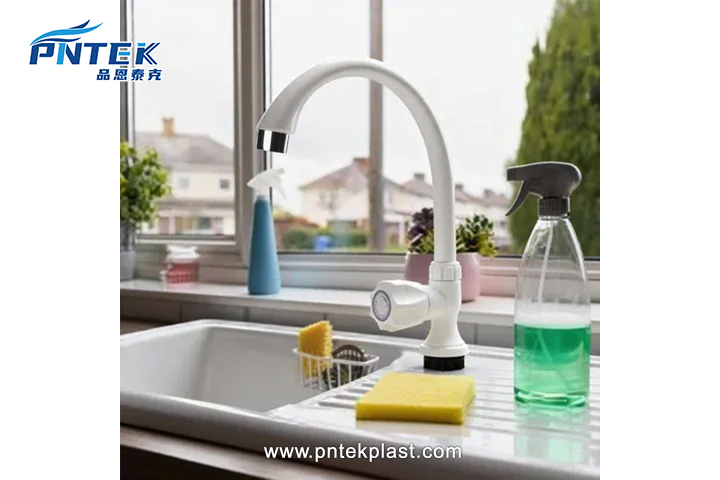 Modern Plastic Faucet Quality A clean, white plastic faucet installed in a modern kitchen sink