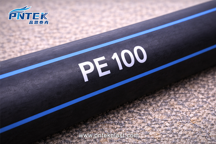A close-up shot of an HDPE pipe with 'PE100' clearly printed on the side