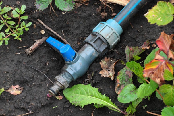 A high-quality PVC ball valve installed on a pipe in an irrigation system
