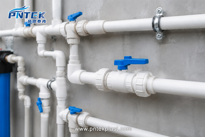PVC Ball Valves in Water Supply System A clean water supply system using white PVC pipes and ball valves