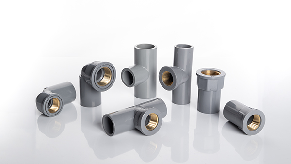 A collection of various transition fittings for different pipe materials and sizes