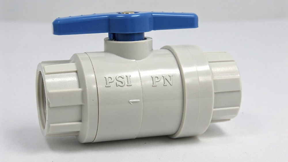 A close-up shot of the pressure rating stamped on a PVC ball valve